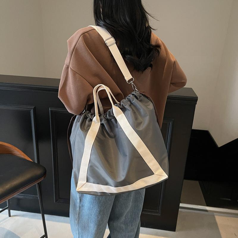 Lazy wind large-capacity bag women's spring and autumn fashion versatile handbag pumping mouth commuter bag shoulder messenger bag
