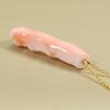Undyed pink garnet coral branch pendant necklace.