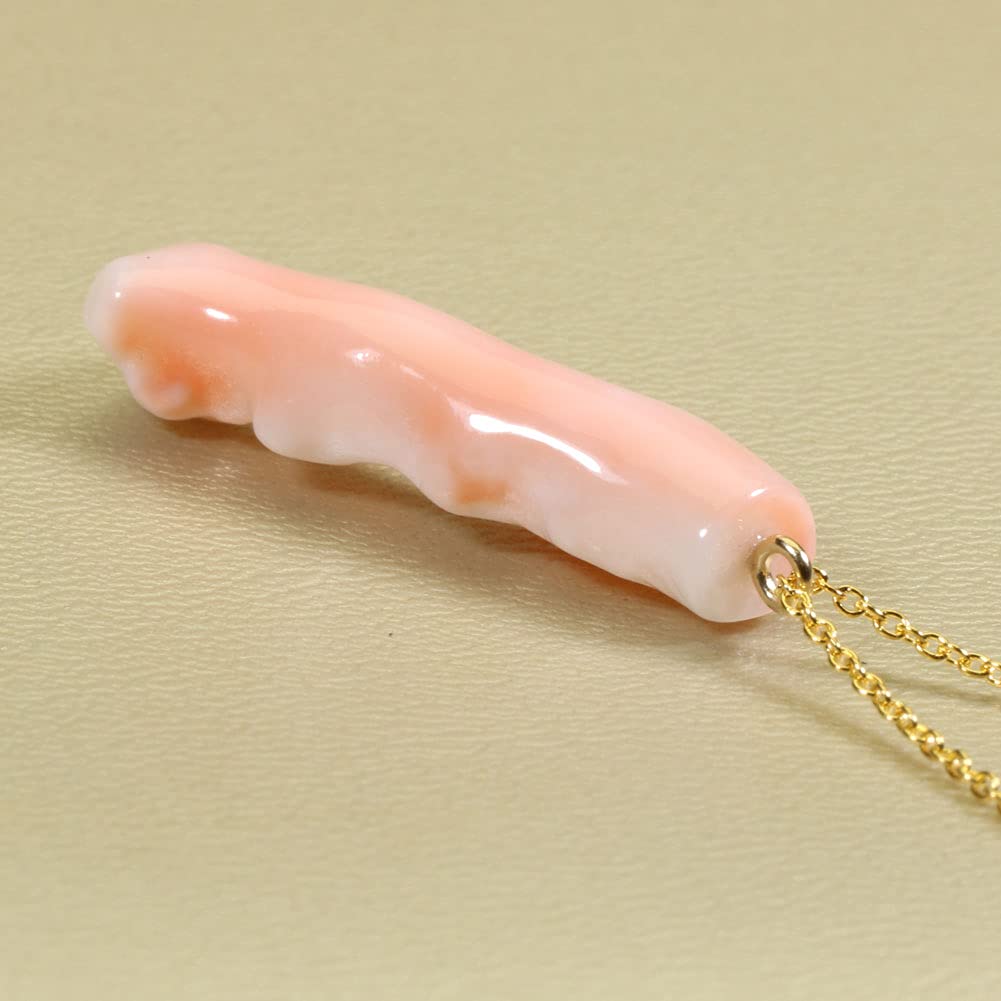 Undyed pink garnet coral branch pendant necklace.