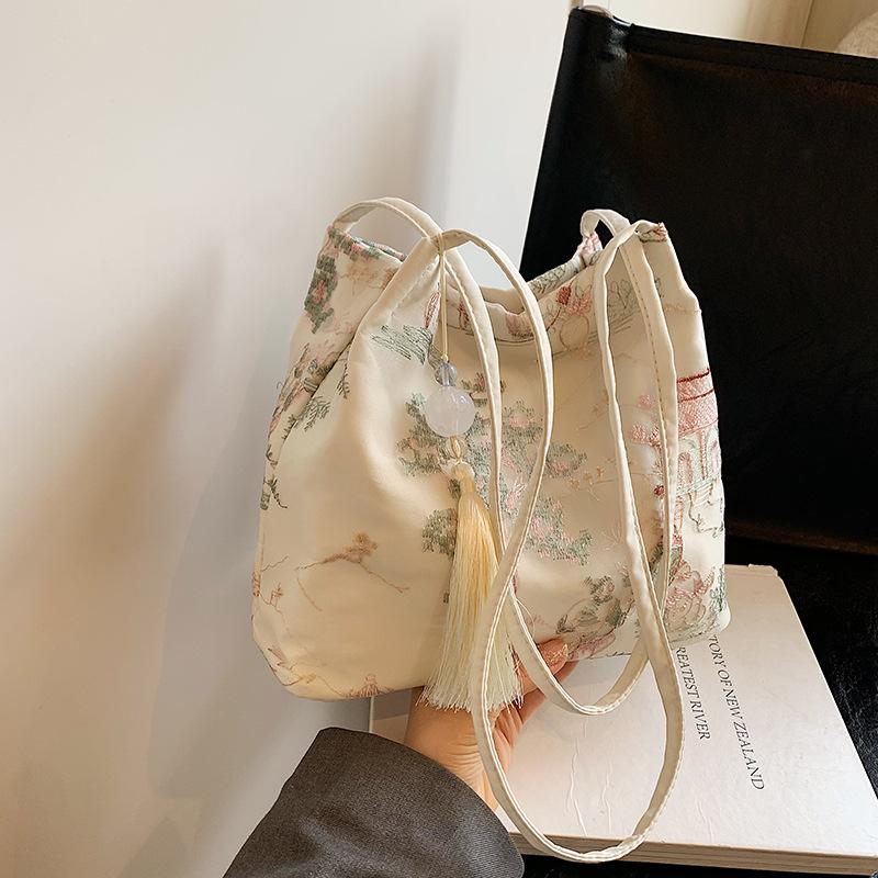 Borsa a tracolla ricamata di grande capacità Borsa estiva alla moda in tessuto da donna Borsa a tracolla con ricamo di nicchia Borsa a secchiello con texture Borse in tela
