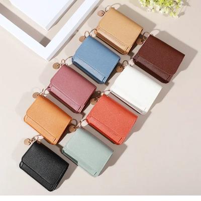 Nové roztomilé peněženky pro ženy Malé Hasp Girl Držák kreditních karet pro PU koženou peněženku na mince Dámská peněženka Krátké peněženky pro ženy