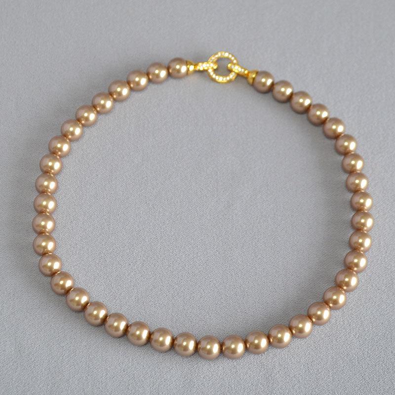 

Французское винтажное идеально круглое ожерелье с круглой пряжкой из таитянского мокко с бриллиантами и цирконами на ключичной цепочке