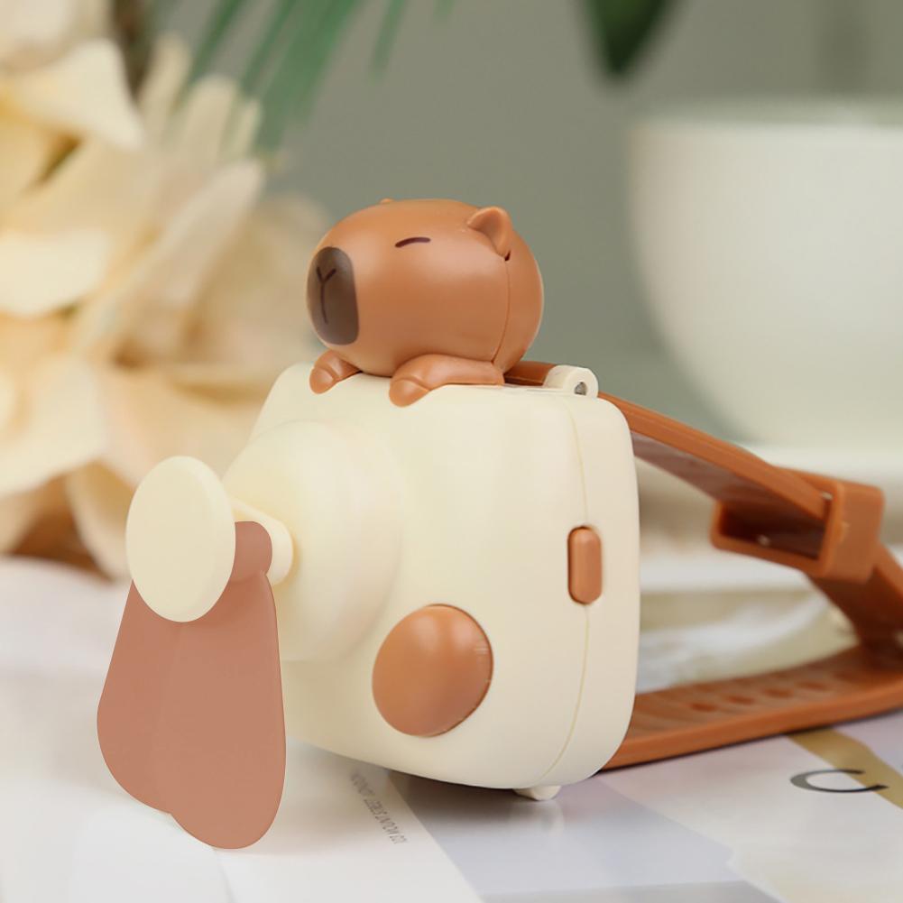 

New Design Electric Fan Rechargeable Capybara Shaped Wrist Fan Kawaii Carpincho Foldable Design for Daily Use Outdoor Essentials белый