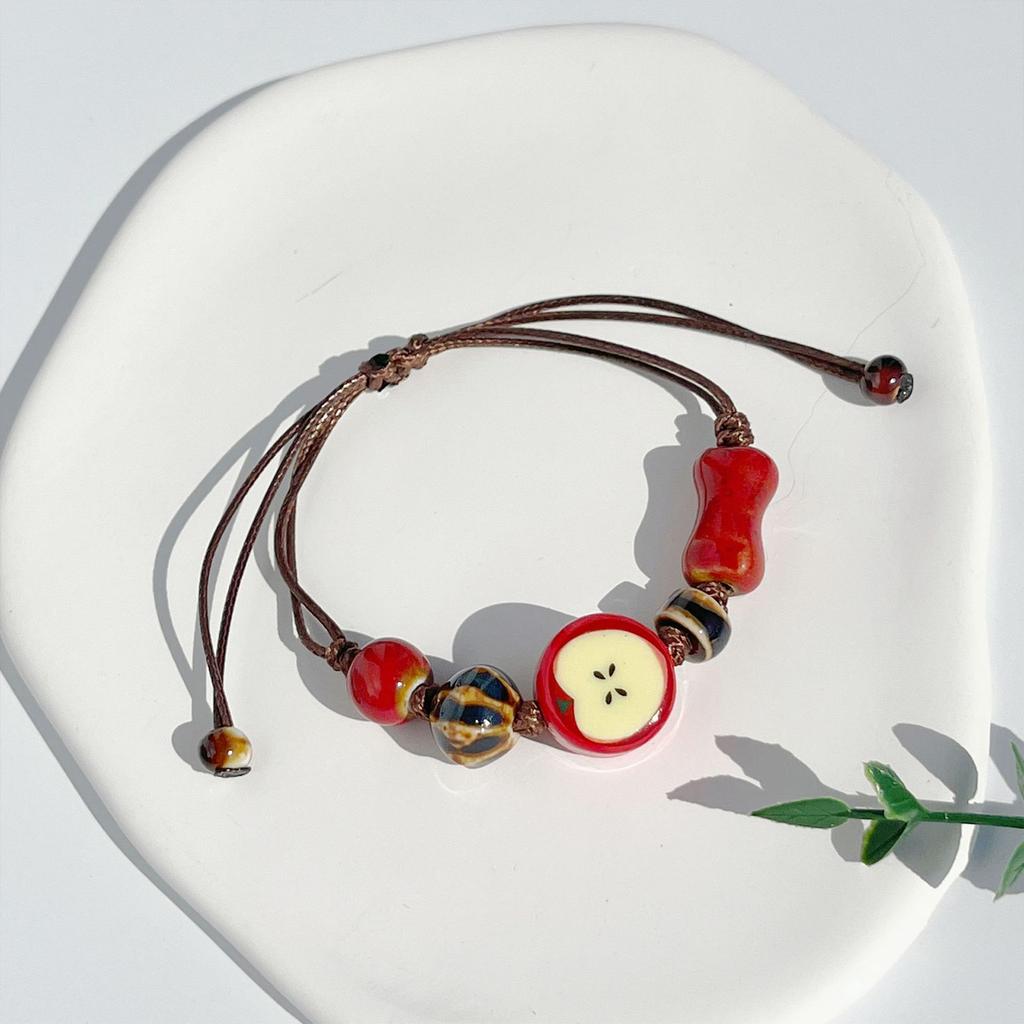Artistic Ceramic Bracelet Apple Charm Bracelet Handwoven Cord Bracelet Present for Youthful Trendsetters and Art Lovers
