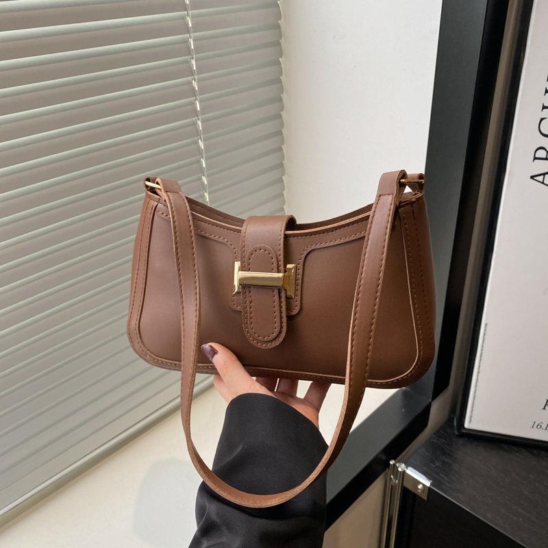 Frühling und Sommer neue vielseitige Temperament Damen einfarbig hochwertige Textur Pendeln Achseltasche Damen Handtrage tragbare Schultertasche