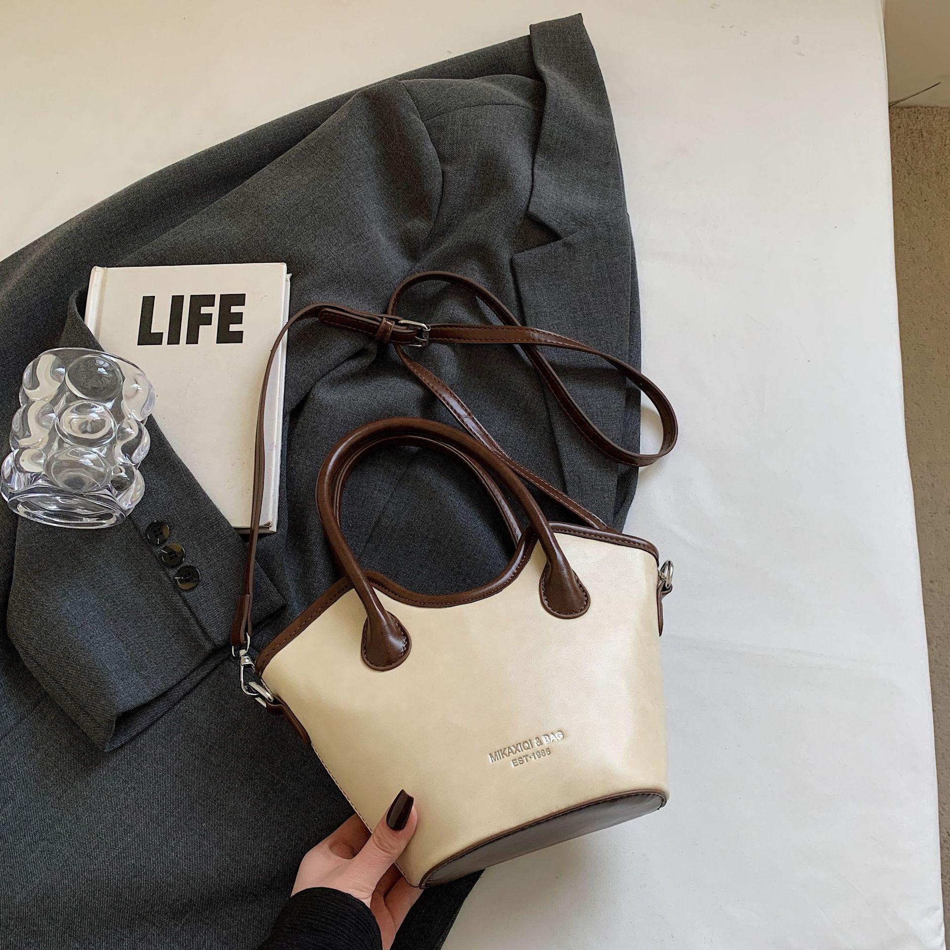 

Нишевая сумка женская 2025 новая весна и лето универсальная сумка популярный стиль универсальная подмышечная на плечо женская сумка грязно-белый