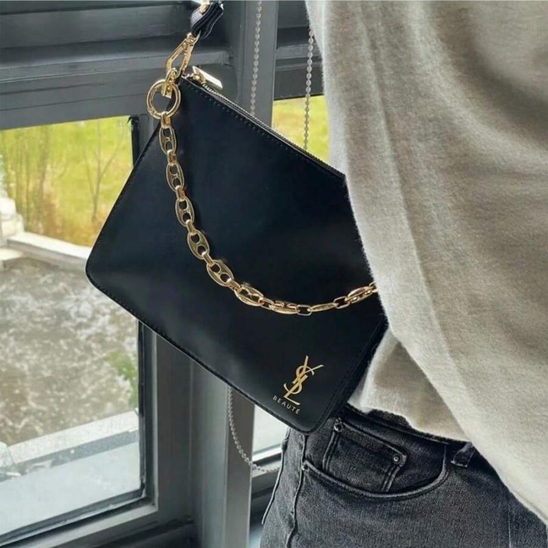 YSL black makeup crossbody bag with chain detailing, portable design, and large capacity, suitable for everyday use and travel.