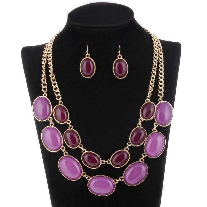 

Большие модные золотые многослойные короткие серьги-колье с фиолетовыми акриловыми бриллиантами.