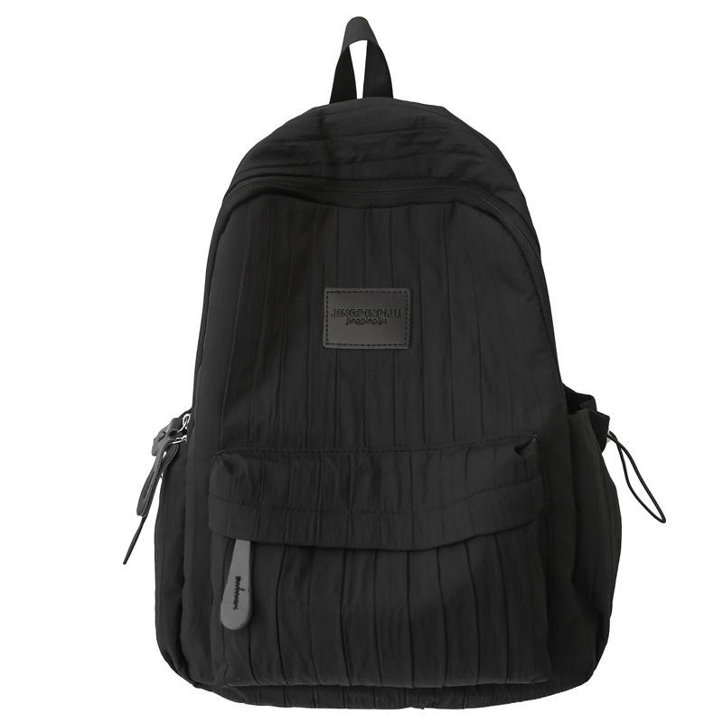 Fashion travel lightweight middle school college students class solid color backpack 2025 new simple niche design school bag