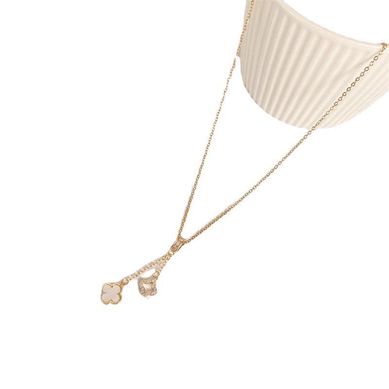 Copper-Plated Gold Four-Leaf Clover Tassel Pendant Necklace - Elegant, Minimalist, and Luxurious.