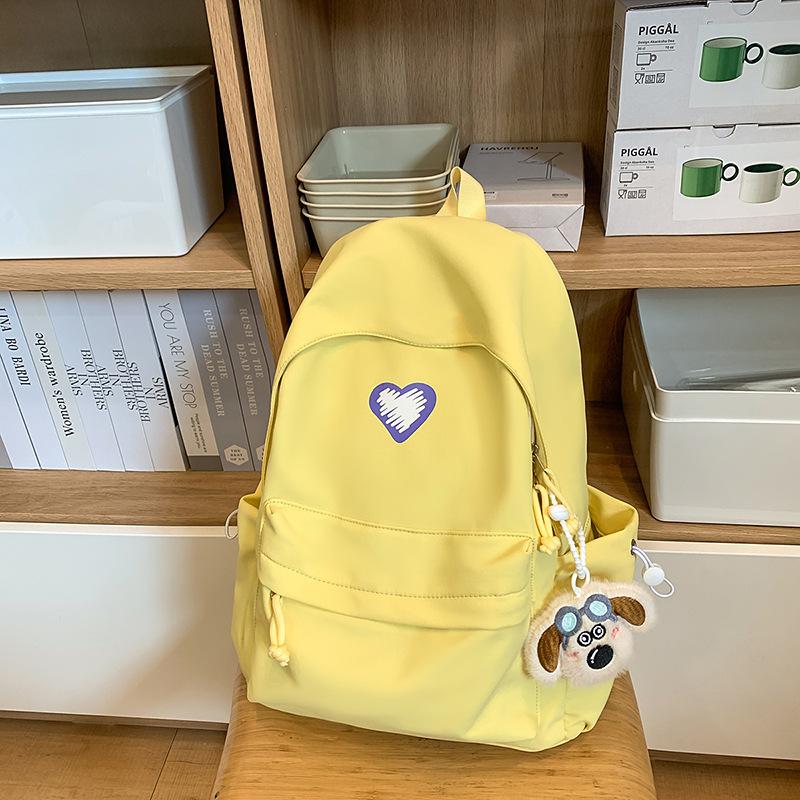 School bags, female college students, simple solid colors, love, junior high student, niche and versatile girls, high school student backpacks, trends
