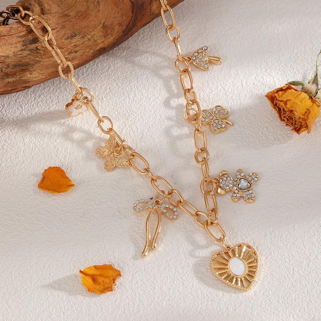 Heart Pendant Necklace For Women With Butterfly Bow And Clover Charm In Silver Plating