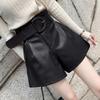 Vielseitige High-Waist-Shorts und Weitbeinige Hosen mit Ledergürtel für Damen: Frühlings-, Herbst- und Winteroberbekleidung.