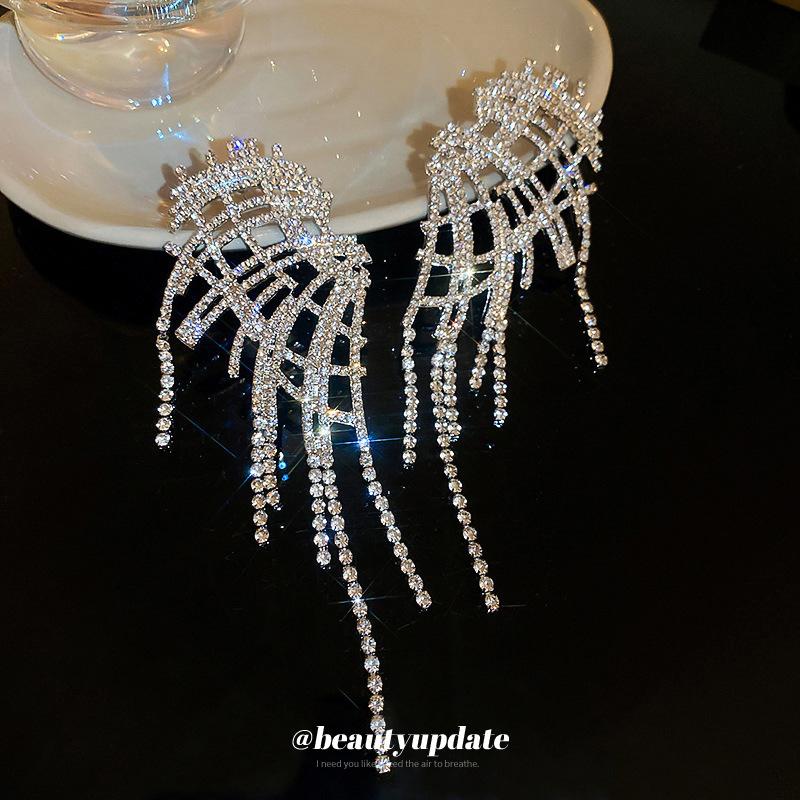 Silver needle with diamond wings hollow fringed earrings European and American exaggerated earrings temperament light luxury earrings women