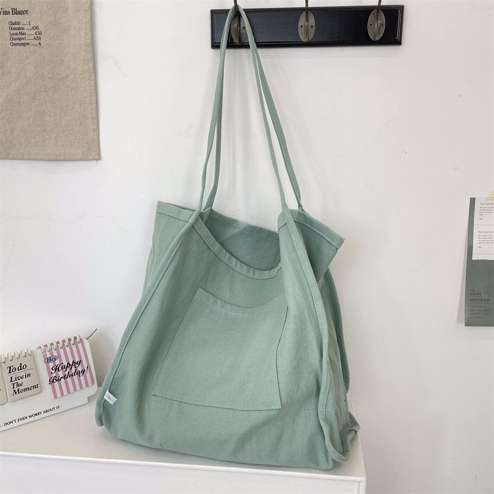 

Solid color large-capacity casual bag women s new simple student shoulder canvas bag portable texture tote bag