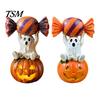 Halloween Party Supplies Ghost Figurine, Cute Sitting on Pumpkin Holding Candy Non Scary Holiday Decor Statue, Spooky Resin Table Ornament for Indoor