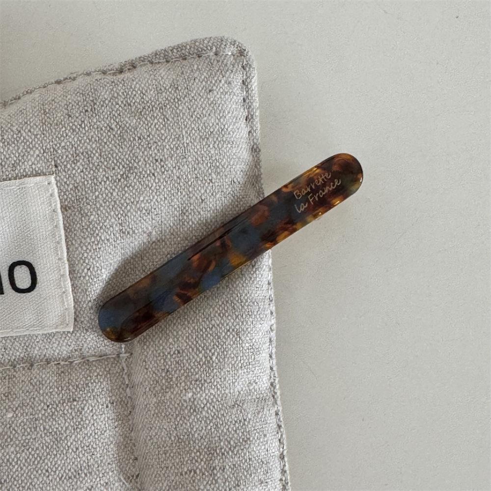 Korean version of the gold label cute little baguette one-word clip French acetic acid texture solid side bangs clip