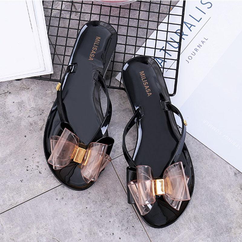 

2024 Летние женские шлепанцы для дома и улицы Тапочки с бантом Повседневные тапочки на плоской подошве ПВХ Желе Женские пляжные шлепанцы Обувь 36 чёрный