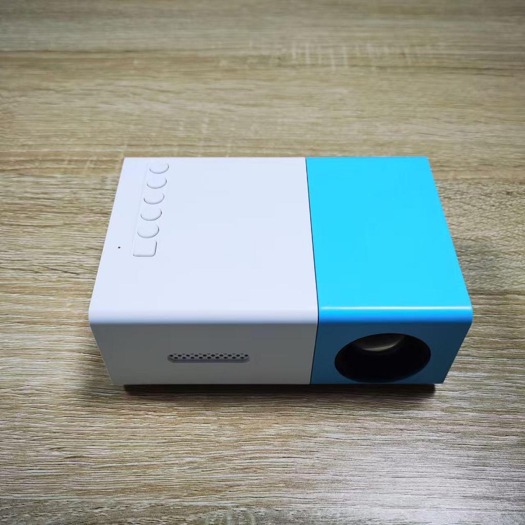 Best-Selling YG300 Yellow-White Mini Portable Projector with Mobile Screen Mirroring for Home Entertainment.