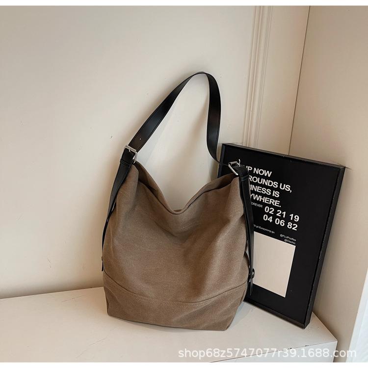 Casual large-capacity canvas bag women's 2025 new simple fashion tote bag Korean version commuter crossbody bag trend