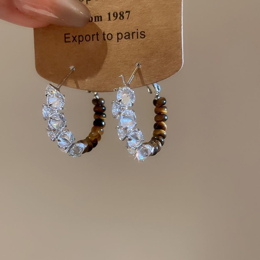 Silver Needle Tiger's Eye Style Earrings: Elegant, Fashionable Studs with Caramel Color Finish.