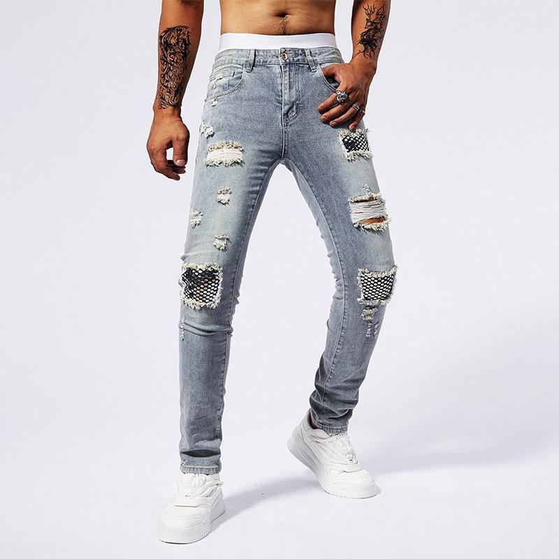 

Четырехсезонные хлопковые мужские джинсы модного кроя с вышивкой в виде пуль и рваным принтом 36