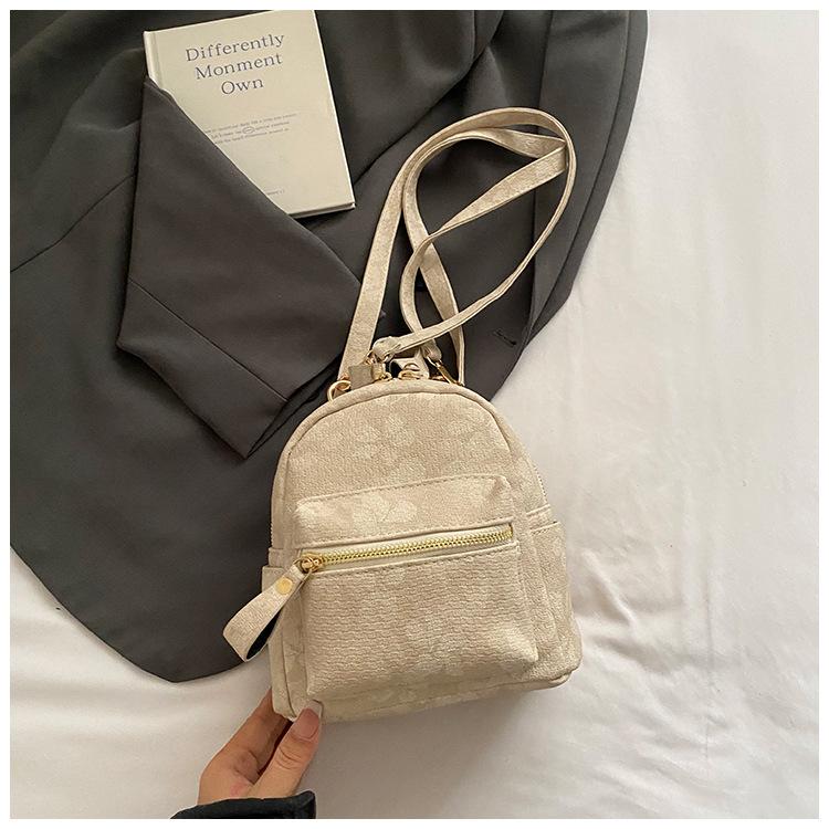 

Студенческая сумка для книг для колледжа женская 2025 лето новая маленький рюкзак простой для поездок на работу дорожный рюкзак бежевый