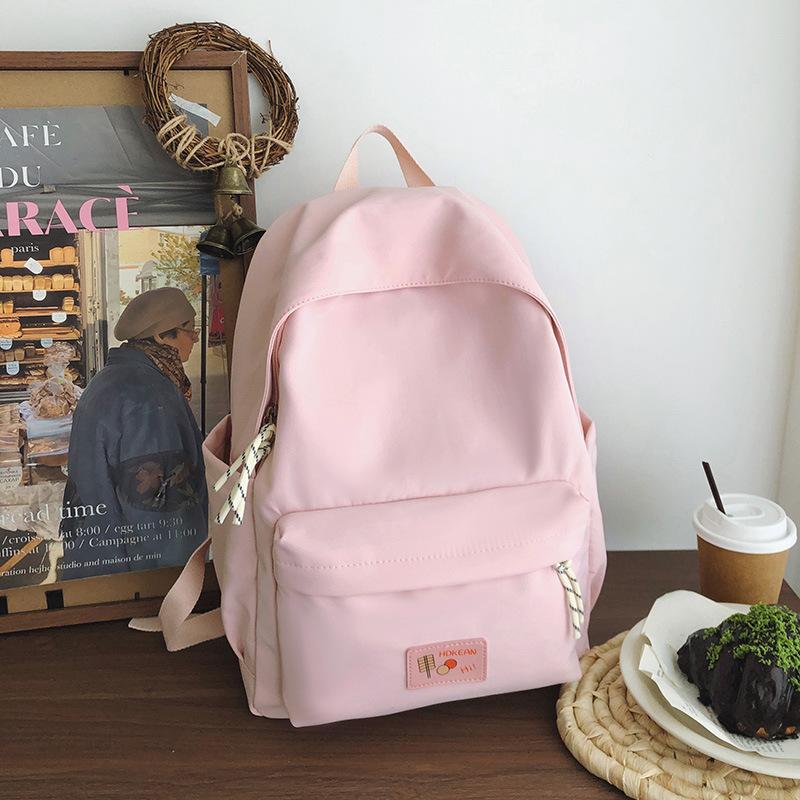 New casual simple solid color backpack large capacity junior high school student schoolbag