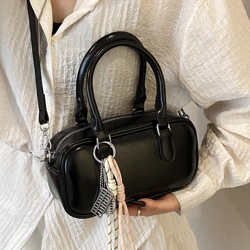 Retro commuting simple Korean version casual solid color portable bowling bag fashion high sense versatile commuting messenger bag