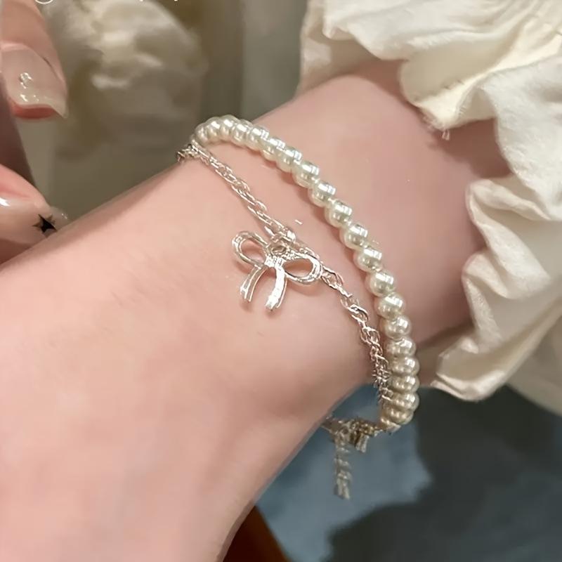 Hot-selling creative bow imitation pearl bracelet set temperament double-layer stacked earrings women