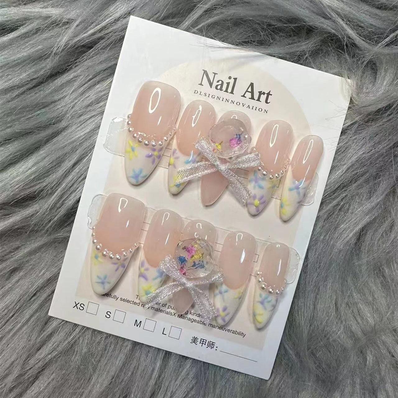 

Handmade Wearable Nail Art with Dried Flowers, Pearls, and French Lace Bow Extra Small XS