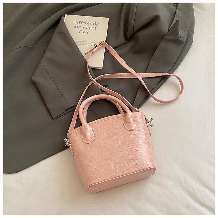 

Casual simple sweet bucket bag women 2025 new solid color fashion trend messenger bag commuter simple handbag розовый