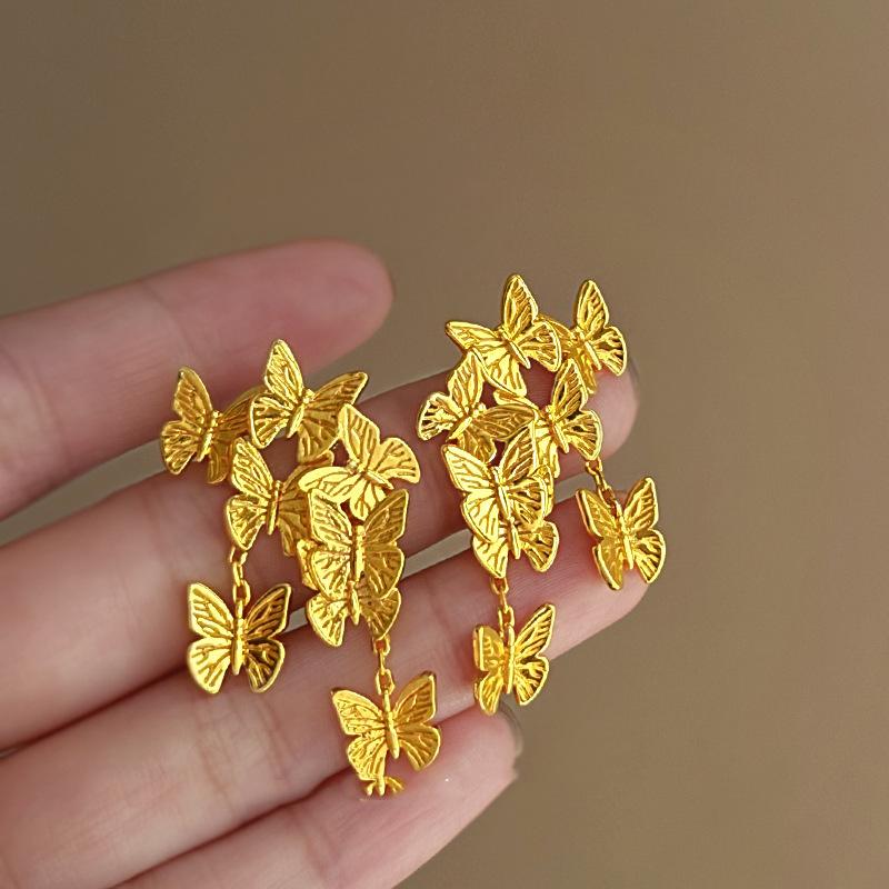 

Silver needle metal cold wind butterfly earrings simple fashion design sense stud earrings temperament light luxury high sense earrings women