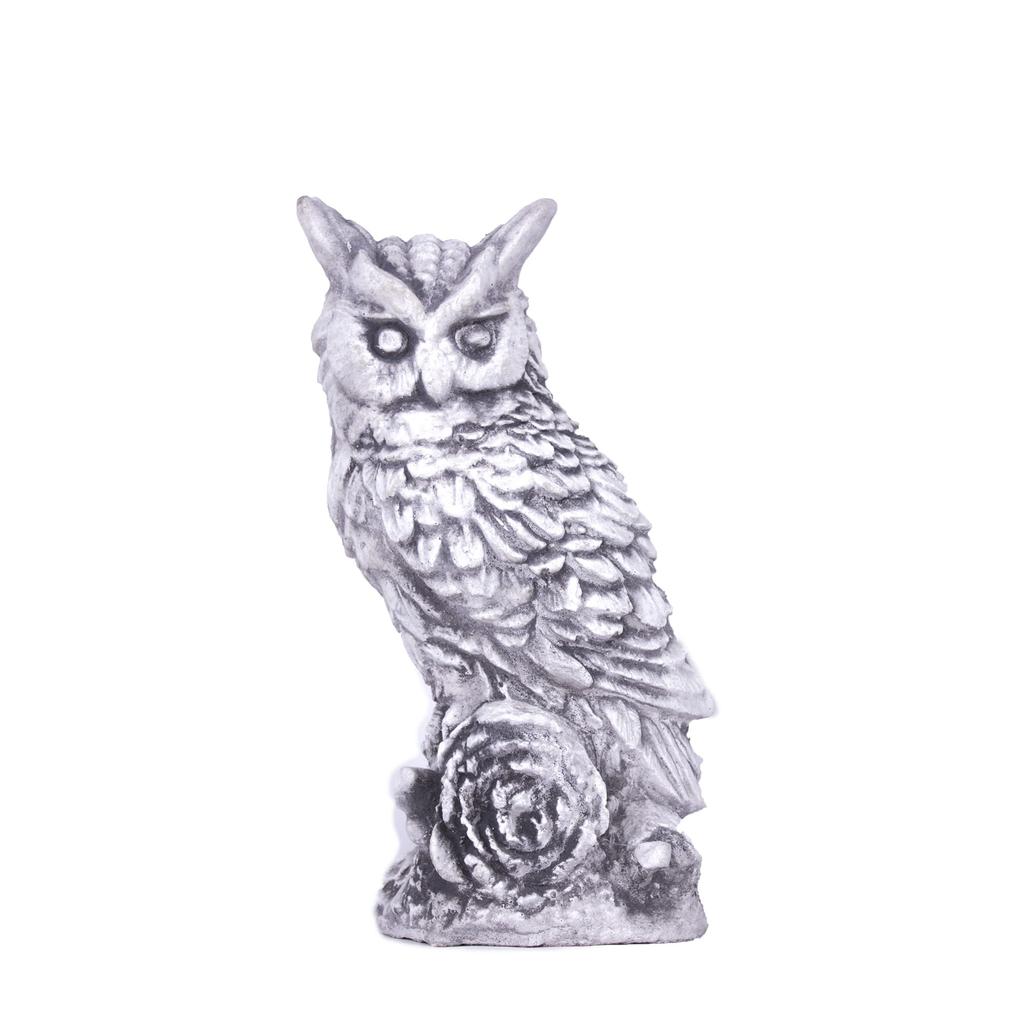 Garden sculpture of concrete owl figurine