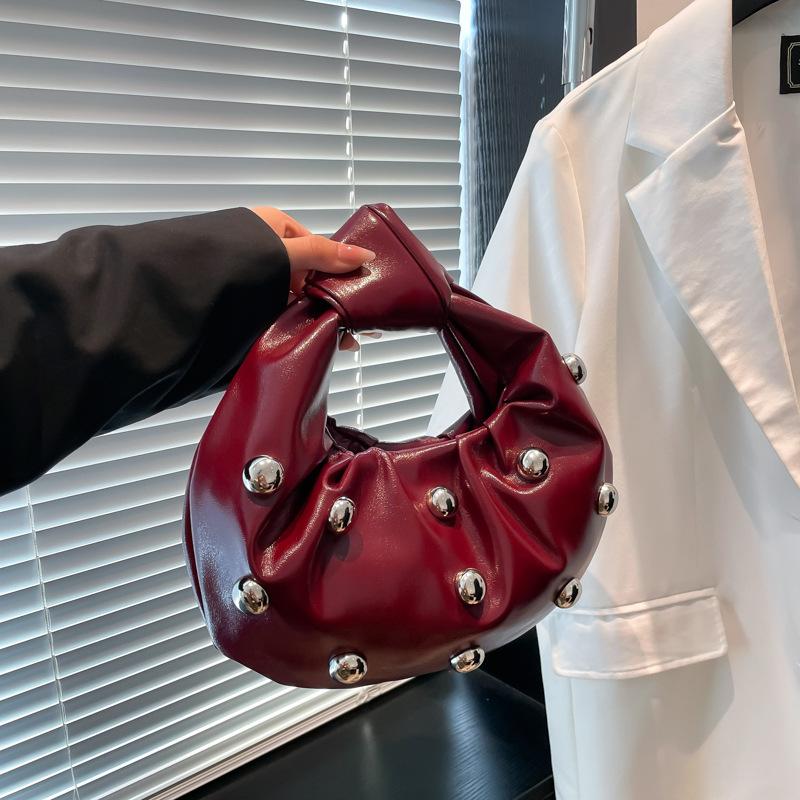 Internet celebrity armpit bag 2025 new Korean version fashion rivet shoulder bag women's versatile pearl hand carrying dumpling bag tide