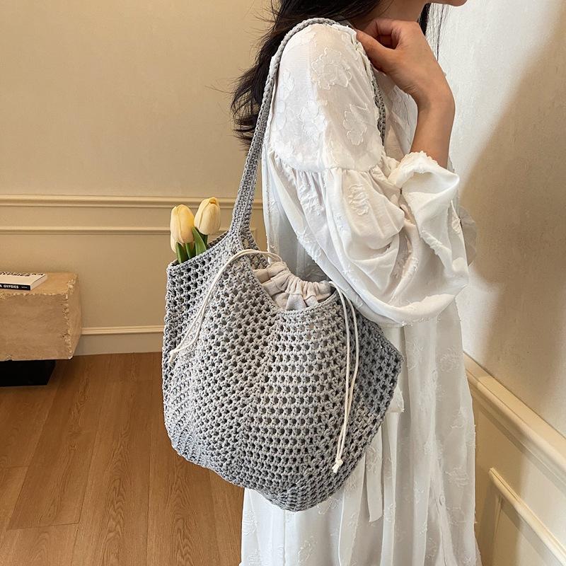 2025 spring and summer new hollow bucket bag shoulder woven bag large capacity tote bag fashionable beach women's bag