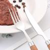 Japanese 304 Stainless Steel Cutlery Set with Wooden Handles: Knife, Fork, Spoon, Dessert Spoon, and Steak Knife for Western Cuisine and Hotel Use.