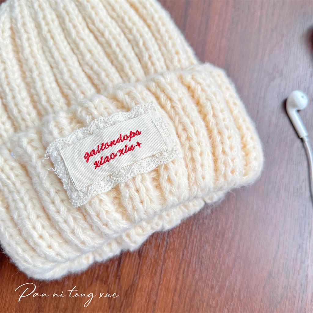 Neue Spitze Etikett Kinder Wollmütze Nuojiji Student Herbst und Winter Neu Warm und Vielseitig Ohrenschutz Strickmütze