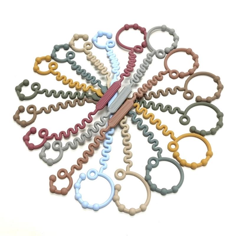 Vielseitiger Flaschenhalter für Beißringe mit Silikonband – Praktische und zuverlässige Befestigungsmöglichkeit für Beißringe am Kinderwagen oder Hochstuhl