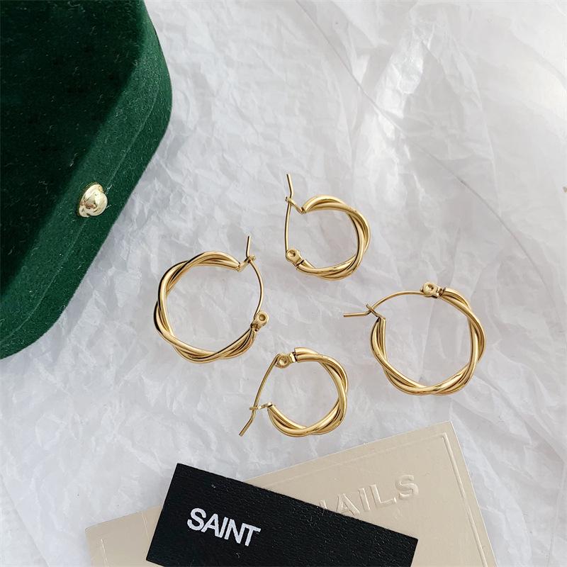 French Retro Gold-Plated Twisted Hoop Earrings - Titanium Steel Studs for Women, European-American Fashion.