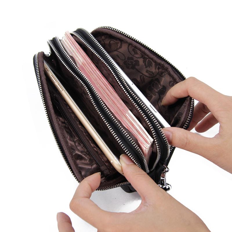 Top Layer Cowhide Women's Clutch: Genuine Leather Long Wallet with Three-Layer Zipper, Large Capacity, Wrist Strap.