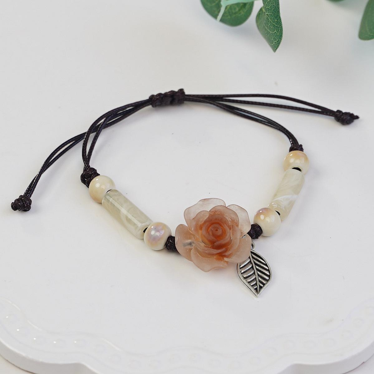 

Camellia woven bracelet new ethnic style Mori literary and ancient style hand rope fashion trend