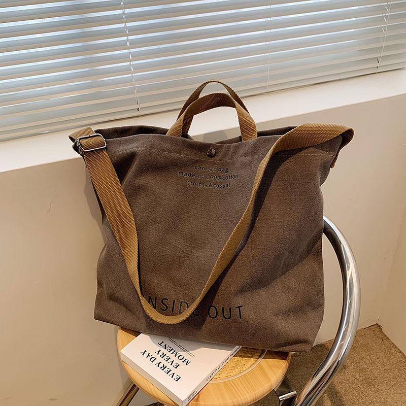 Borsa a tracolla semplice in tela da uomo e da donna. Borsa a tracolla in tela spessa. Borsa a tracolla per studenti d'arte di grande capacità