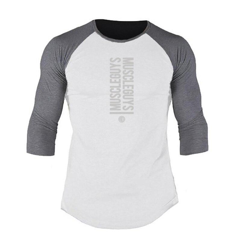 

Muscleguys Новый хлопок Мужская корейская версия Тонкая футболка Весна и осень Средний рукав Топ Белая строчка Три четверти рукавов XXL белый