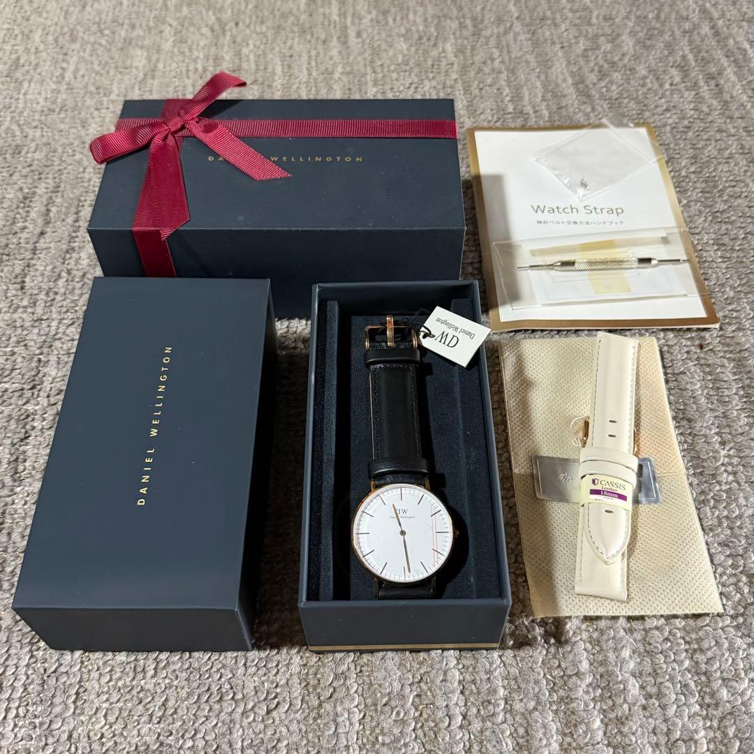 Used New, unused Daniel Wellington watch with box and replacement strap.