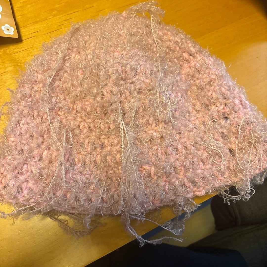 Used pink knit hat made of wool
