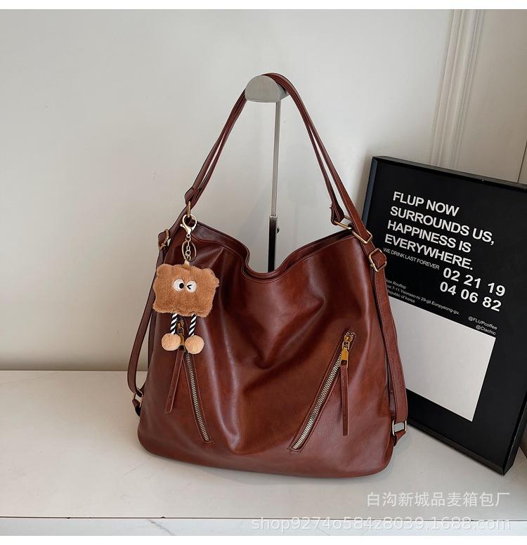 

Casual large-capacity women s backpack 2025 new versatile shoulder backpack fashion explosion three-purpose shoulder bucket bag коричневый