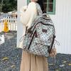 Schoolbag Korean plaid star backpack for female middle and high school students, large-capacity schoolbag, light and dirt-resistant versatile backpack