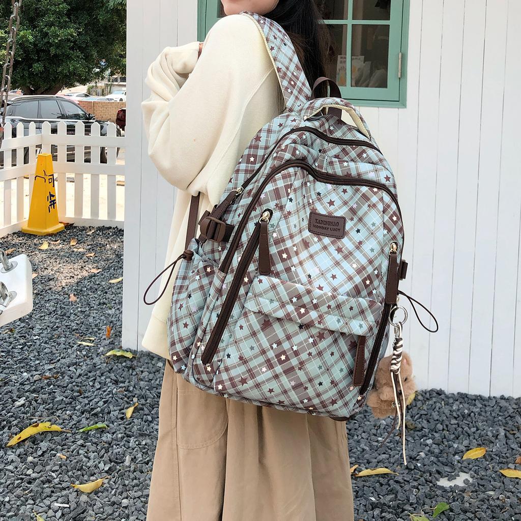 Schoolbag Korean plaid star backpack for female middle and high school students, large-capacity schoolbag, light and dirt-resistant versatile backpack