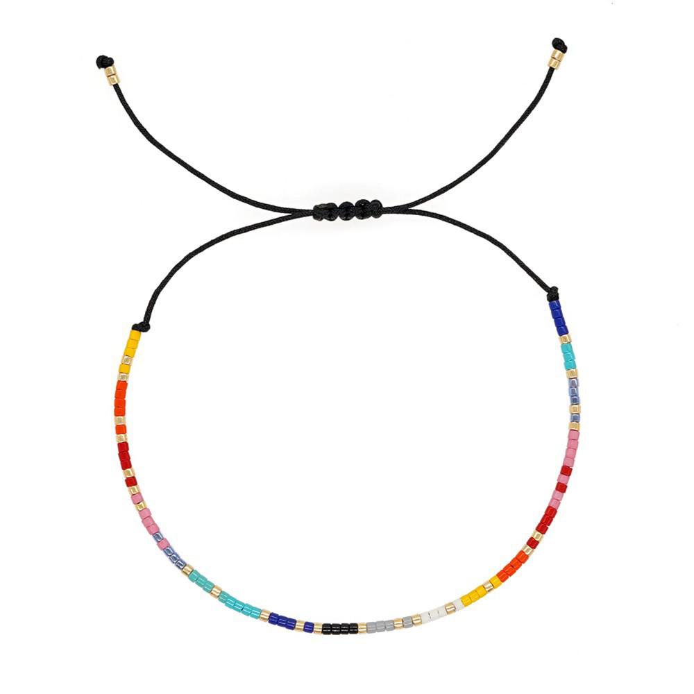 

Elegant Beaded Bracelet: Fresh Blue & Pink with Gold Accents, Adjustable Cord, Versatile & Fashionable Hand Jewelry.
